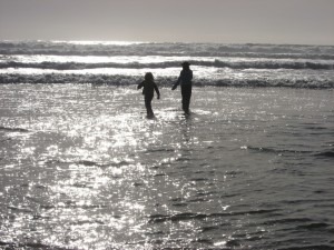Children playing on Long Beach BC – Self-investment and lifelong mental wellness imagery for a Vancouver psychology clinic